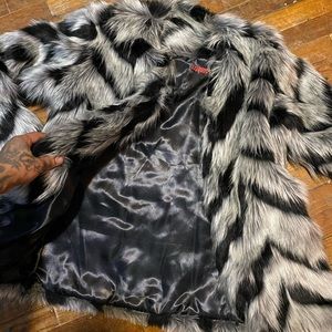 Women faux fur custom made coat .